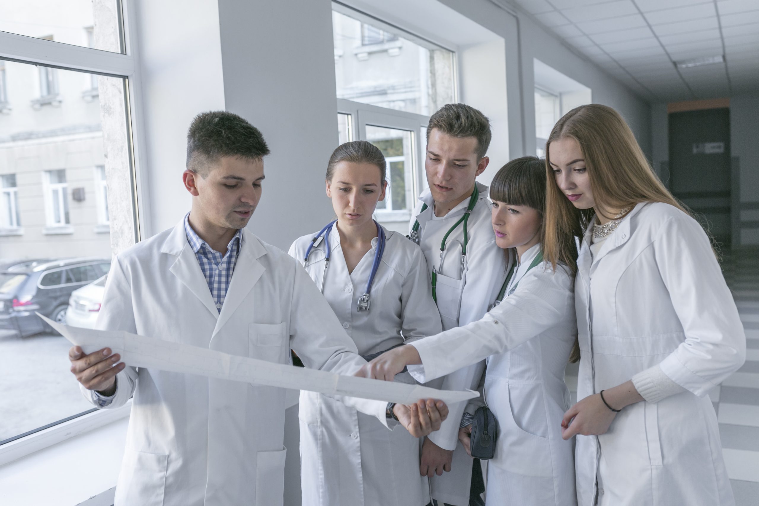 medics-looking-cardiogram-hall